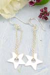 Sterling silver fish hook earring decor with chain loop holding a star pattern on bottom