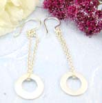 Sterling silver earring decor with chain loop holding a circle pattern on bottom