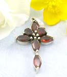 Sterling silver cross pendant with red garnet