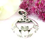 Two hands holding a heart and celtic work on top design with sterling silver pendant