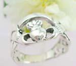 Sterling silver ring with two hand holding a heart and twist line decor each side