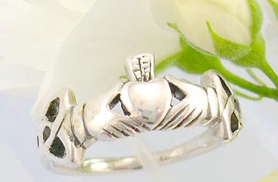 Sterling silver gift idea sterling silver ring with two hand holding a heart and celtic knot work decor each side   